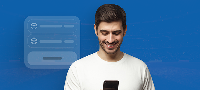 Imagem mostra homem sorrindo ao utilizar um celular